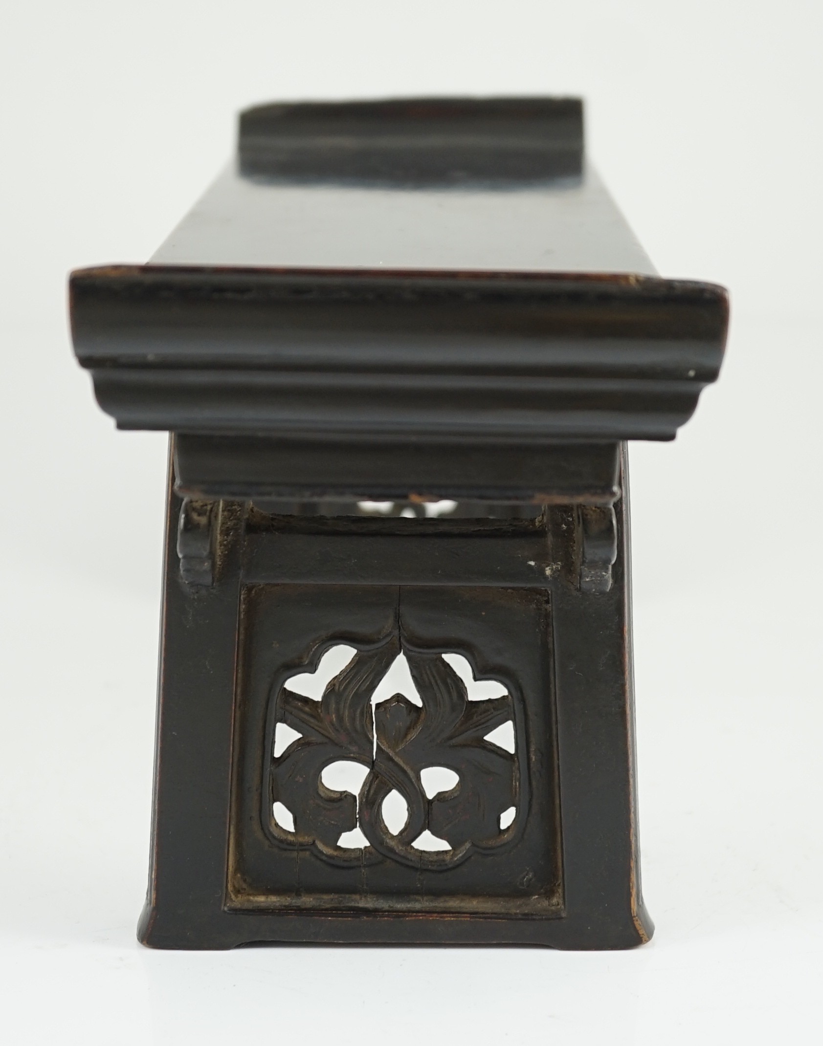 A Chinese late Ming lacquered wood model of an altar table, 17th century, 41cm wide, 16.5cm high, minor losses